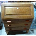 A 1930s oak bureau, the sloping fall over three long drawers. 31' wide