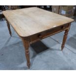 A Victorian pine kitchen table with two end frieze drawers on turned tapered legs. 54' long