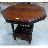 A late Victorian walnut octagonal two tier centre table on turned supports. 29½' diam