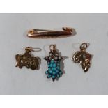 Three gold pendants and a gold 'Baby' brooch. 4.5g gross