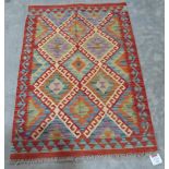 A vegetable dyed wool Choli Kilim rug. 1.22m x 0.84m