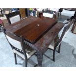 A Victorian extending dining table with a set of four chairs. (A.F.)