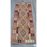 A vegetable dyed wool Choli Kilim runner, 1.5m x 0.61m