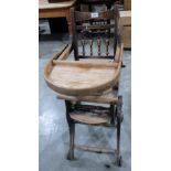 An early 20th century metamorphic infant's high chair/rocking chair. Seat wormed