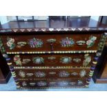 A 19th century Slovakian pine chest of four long drawers, with painted decoration of flowers, raised