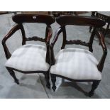 A pair of mahogany elbow chairs