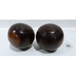 A pair of lignum vitae carpet bowls