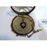 A Victorian gold and blue enamel heart pendant set with an old cut diamond and four split pearls,