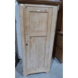 A pine hall robe enclosed by a panelled door. 30' wide