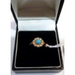 A turquoise and split pearl cluster ring. In gold marked 375. Size M½. 2g gross