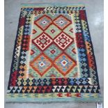 A vegetable dyed wool Choli Kilim rug. 1.44m x 1.0m