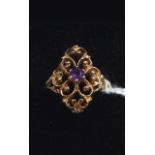 An amethyst filigree ring. In gold marked 375. Size N. 4.6g gross