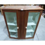 A display cabinet enclosed by a pair of glazed doors. 32' wide