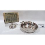 A George V silver perpetual desk calendar, Chester 1922, 2¾' high; together with a George V silver