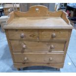 A Victorian pine chest, the gallery top over two short and two long drawers, on turned legs. 35'