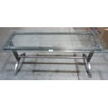 A metal based low table with glass top (cracked). 44½' long
