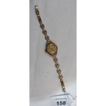 A 9ct lady's wristwatch with 9ct bracelet strap. Gold weight 9.4g inclusive of expanding bracelet
