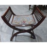 A 19th century mahogany 'X' frame folding stool with tapestry seat
