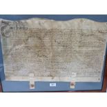 A Queen Anne period indenture on vellum, 1708. Framed. 15' x 23'