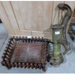A cast iron fire grate and an iron pump