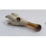 A Victorian Scottish grouse foot brooch, set with two amethysts in gold plated mounts