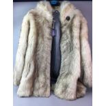 A LADY'S MID LENGTH FUR COAT