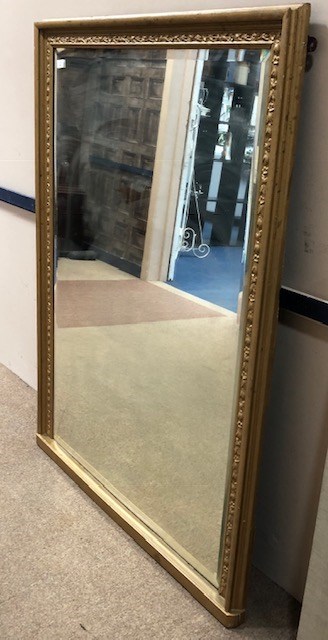 A GILT FRAMED OVER MANTEL MIRROR