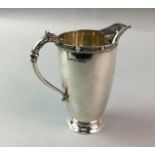 A SILVER CREAM JUG