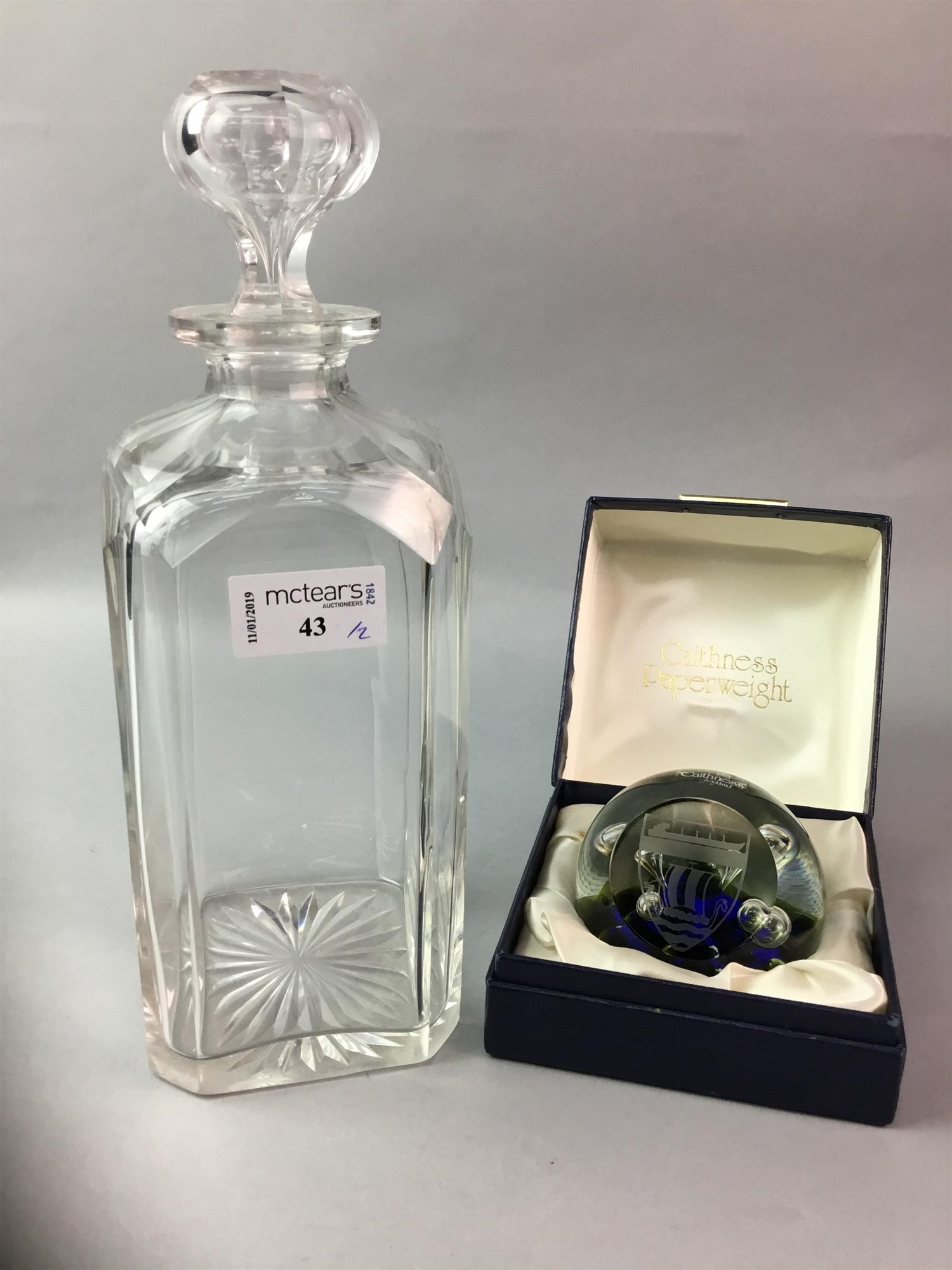 A CAITHNESS MOONFLOWER PAPERWEIGHT AND A DECANTER