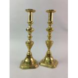 A PAIR OF BRASS CANDLESTICKS AND THREE FIGURES OF LADIES