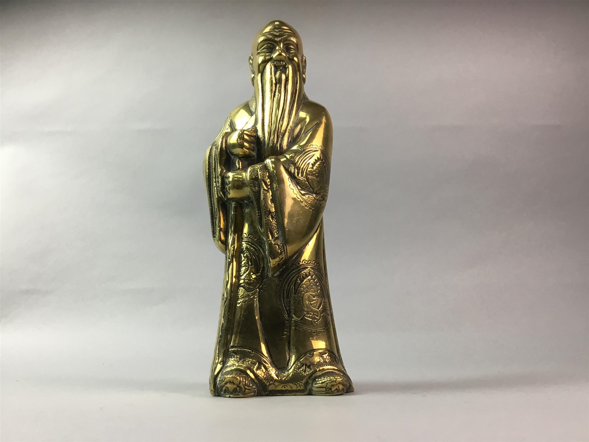 A CHINESE BRASS FIGURE OF SHAO LAO, SEATED BUDDHAS AND A SCROLL HOLDER