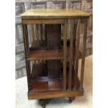 A MAHOGANY INLAID REVOLVING BOOKCASE