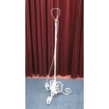 A WHITE PAINTED METAL FLOOR LAMP