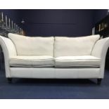A CONTEMPORARY WHITE LEATHER SETTEE