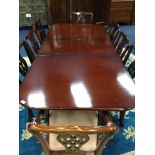 A MAHOGANY DINING TABLE AND EIGHT CHAIRS