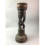 A LARGE OAK CANDLESTICK