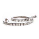 A PRINCESS CUT DIAMOND TENNIS BRACELET