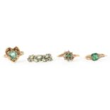 FOUR GREEN GEM SET RINGS