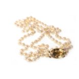 A PEARL NECKLACE WITH GEM SET CLASP