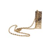 A NINE CARAT GOLD INGOT PENDANT ON CHAIN