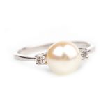 A PEARL AND DIAMOND RING