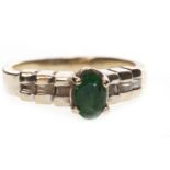 A GREEN GEM AND DIAMOND RING