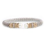 A DIAMOND AND PEARL SET BI COLOUR TORC BANGLE