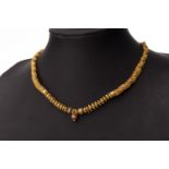 AN ORNATE EASTERN NECKLET