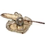 AN ORNATE VICTORIAN SILVER INKWELL WITH SILVER SIMULATED FEATHER QUILL PEN