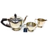 AN ART DECO SILVER THREE PIECE TEA SERVICE