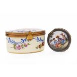 A CONTINENTAL SILVER GILT AND ENAMEL PILL BOX AND A FRENCH PORCELAIN PILL BOX