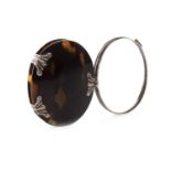 A TORTOISESHELL AND SILVER MOUNTED MAGNIFYING GLASS