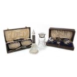 AN EDWARD VIII SILVER CRUET SET WITH SILVER COLLARED CRYSTAL