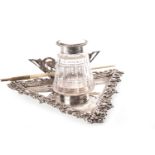 A VICTORIAN SILVER LIDDED GLASS INKWELL WITH A MOTHER OF PEARL PEN HOLDER